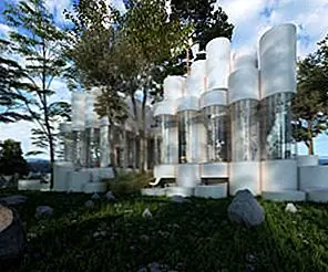 Дом из цилиндров сидит среди деревьев