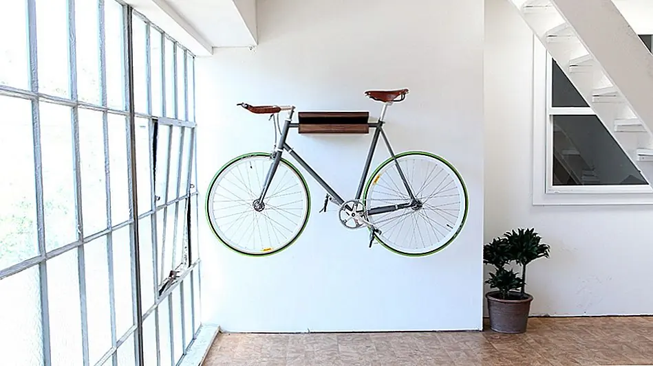 Эта полка специально разработана для велосипедов и изготовлена из твердого ореха или твердой золы. Он отлично смотрится на вашей стене, и вы никогда не сможете догадаться, для чего он используется без велосипеда, прикрепленного к нему. Это абсолютно естественный и приятный вид, а также дает отличный воздух для вашей комнаты. Нет винтов или болтов и никаких уродливых аксессуаров. Это просто простая, но очень приятная полка, которая легко наносится на стену и проста в использовании. Вы просто возьмите велосипед и повесьте его со стены. Вы можете приобрести этот товар здесь за $ 299.