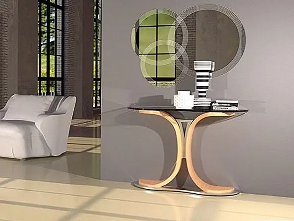 Простые чистые линии консоли Mistral дополняются мягкими и красивыми кривыми и элегантным внешним видом. Основание выполнено из многослойной древесины с черным ореховым шпоном и глянцевым хромированным центральным элементом. Верх сделан из стекла, который позволяет основанию быть центральным элементом и фокальной точкой.