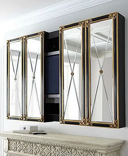 Если вы решите спрятать свой телевизор за дверью шкафа, по крайней мере, выберите что-то стильное и привлекательное. Этот плазменный телевизор имеет очень шикарный дизайн, с зеркальными дверями и черной лаковой отделкой. Это четырехпанельный настенный шкаф ручной работы из дерева и скошенного, зеркального стекла с акцентами с плавающей смолой. Габаритные размеры шкафа составляют 64 "W x 10" D x 51 "T; 120 "Вт, и он может вмещать 50 '' и 60 '' телевизоров.