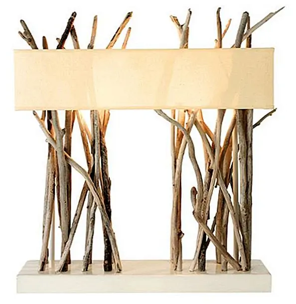 Эта поразительная настольная лампа была сделана с корягой от французского эко-дизайнера Bleu Nature. Мы уверены, что освещение здесь гордится Матерью-природой.