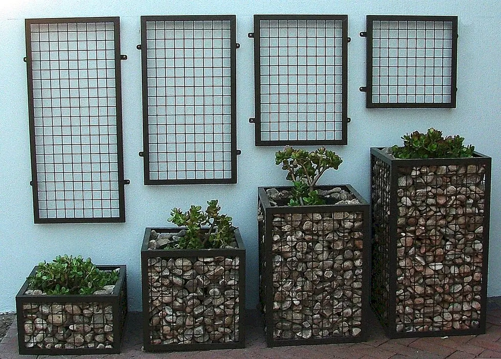 Эти плантаторы упаковывают как натуральный, так и натуральный вид. Они могут быть неожиданным элементом современного пейзажа. У них также есть скульптурный вид. {Найден на flickr}.