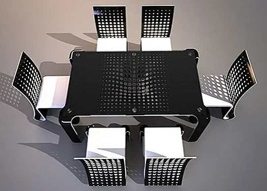 Таким образом, стол является лишь предлогом для восхищения необычными постмодернистскими стульями. Они сделаны из какого-то металла с отверстиями в нем, а спинка осталась на земле с каким-то складчатым капюшоном. Стулья покрыты бежевой имитацией кожи, которая идеально контрастирует с черным столом.